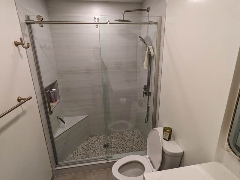Bathroom Remodel — Glass slider shower, quartz vanity, pebble floor