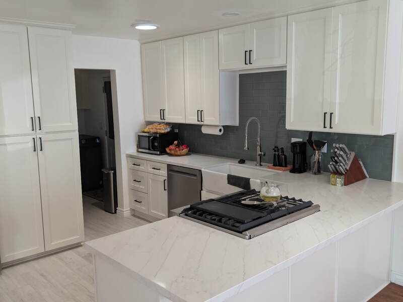 Before: Kitchen — Original oak cabinets & green countertops before remodel