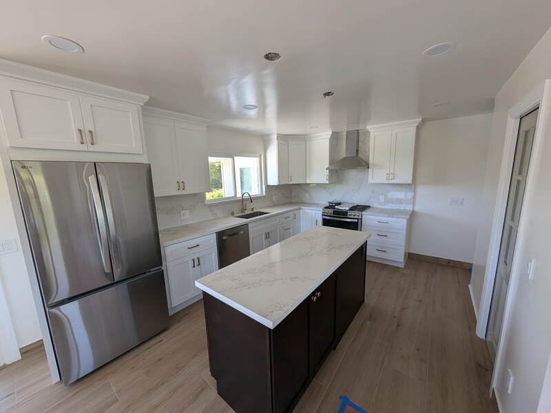 Kitchen Remodel — White shaker cabinets, quartz counters, island with dark base