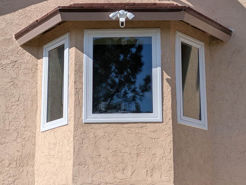 Window Replacement — Bay window installation on stucco exterior